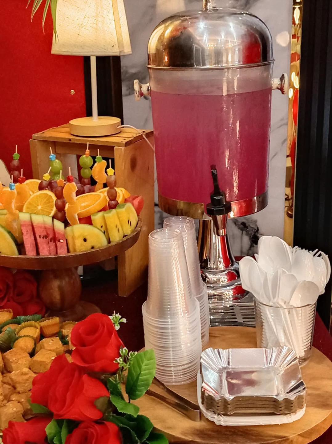 A fruit and drink station prepared for an event by Pots and Buds Cactus Cafe